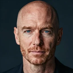 color portrait of a middle aged balding blue eyed ginger white male model By Emmanuel Lubezki