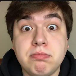 close - up photo of markiplier with an absurdly large chin, clear eyes looking into camera, livestream screenshot