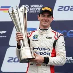 charles leclarc holding the world drivers championship trophy for 2 0 2 2