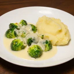 brussel sprouts on white gravy , mashed potatoes, Michelin star, award winning