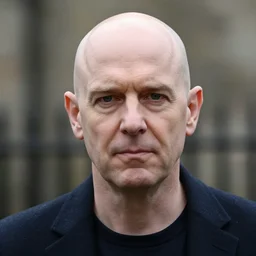 a bald man who has a face resembling margaret thatcher
