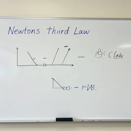 newtons third law written on a whiteboard