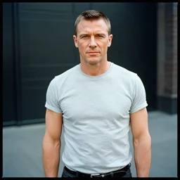 photo portrait of daniel - henney as james bond in streetwear, shot on tri - x with a hasselblad 5 0 0