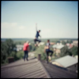 lomo photo out of focus of roofjumpers climbing on roof of soviet hrushevka, small town, cinestill, bokeh, out of focus