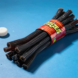 bundle of black licorice on a blue background, candy, twizzlers, shiny, chesley bonestell, vincent di fate