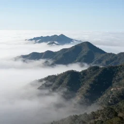 mountains floating above the clouds