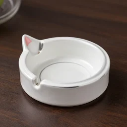 a product photo of a cat ashtray