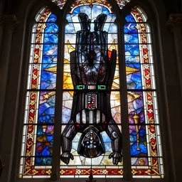 A highly detailed insanely beautiful stained glass window of Darth Vader making a headstand hanging in a church