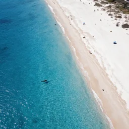 an aerial drone photo of a busy white sands beach and shark-infested, blue waters, fine art photography, trending on Instagram, water caustics