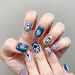 a hand with astronaut themed painted nails