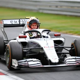 a photo of queen elizabeth driving a formula 1 car, photorealistic