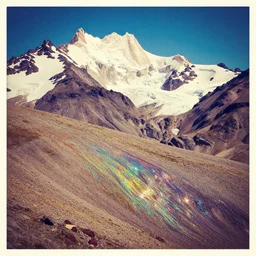 vintage color photo of Cordillera De Los Andes covered in multicolor fluid reflecting light, 8k definition