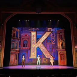 photo of a huge theaterstage, play is cabaret, 3 actors on stage, 8 k, multicolored, exaggerated detailed, long shot