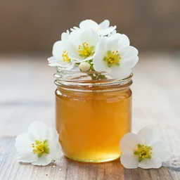 flowers in a jar of honey