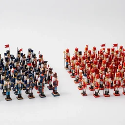 a war between two factions of nutcracker armies, each with a different color and flag. Small, tiny, toy war,