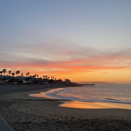 a photo of santa monica beach at sunset with no people
