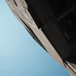 up shot photo on the edge of a building, yaw - 8 5 degrees