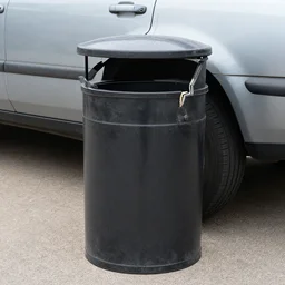 unknown broken grill trash can 2003 vehicle on driveway