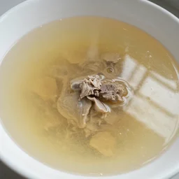 a bathtub filled with liquid soup