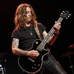 Axl rose playing a Gibson dark fire guitar