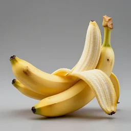a close up studio photo of a banana made of gold