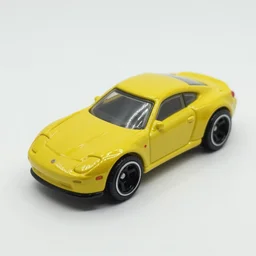 3 5 mm photo of metallic yellow car like pacman, like hot wheels model with a arcade store as background, epic cinematic, epic lighting