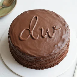 chocolate cake with [ writing ] [ letters ] [ [ [ [ d ] ] ] ] [ [ [ [ w ] ] ] ]