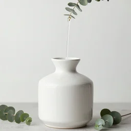 a ceramic still distilling eucalyptus into a liquid