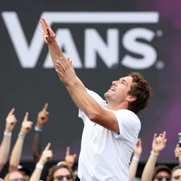 photo still of gallagher at vans warped tour!!!!!!!! at age 4 5 years old 4 5 years of age!!!!!!! throwing watermelons at a crowd, 8 k, 8 5 mm f 1. 8, studio lighting, rim light, right side key light