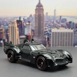 3 5 mm photo of black batmobile batman car like hot wheels model with new york city as background