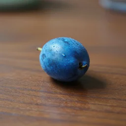 an alien blue fruit on a table