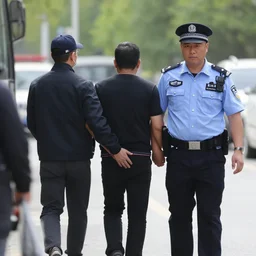 police officer arresting criminal