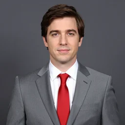 A photo of Markiplier from YouTube wearing a grey suit and red tie, portrait shot, DSLR
