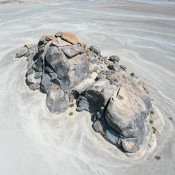 aerial photography, sharp  slate boulders, cool pale desert, ancient civilization