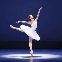 beautiful ballerina in soft lighting dancing in a spotlight on stage