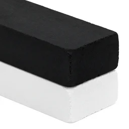 a black brick sitting on top of a white brick