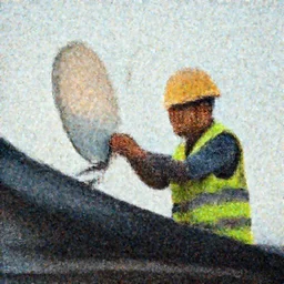 Cat in a high-viz vest and hard hat, installing a wireless dish antenna on the roof of a house. f/22, 35mm, 2700K lighting, award winning photography.