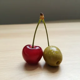one cherry with one olive, on a table
