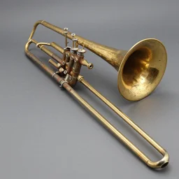 a brass trombone that is rusty from end to end