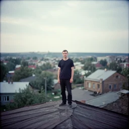 lomo photo of man standing on the roof of soviet hrushevka, small town, cinestill, bokeh, out of focus