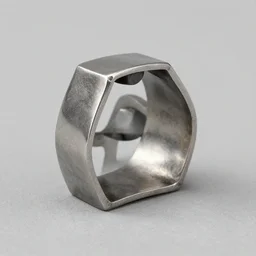 a ring made of cast metal designed by courbusier