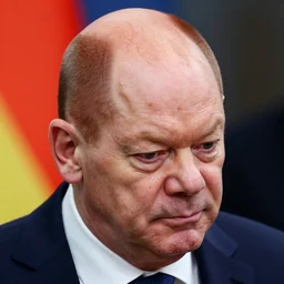olaf scholz has a big red head with thick veins showing from exhaustion