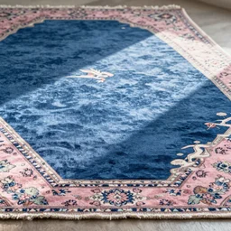 A blue colored Japanese ukiyo-e rug with a Persian rug edge.,with soft pink colors