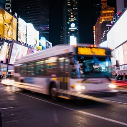 long exposure of times square at night as a bus drives by, light trails, motion blur, iso 1 0 0 f / 1 1, photorealistic