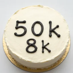 cake with 5 0 k written on it, 8 k