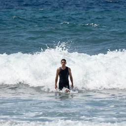 the last man standing is hip deep in wild ocean waves