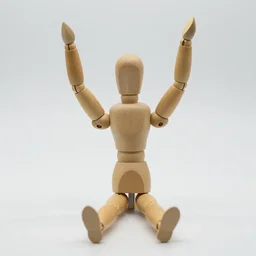 a wooden mannequin sitting with hands in the air