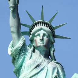 a beautiful statue of liberty sculpture designed by Sandra Chevrier, american indian headdress, American stars and stripes on face, by Annie Leibovitz