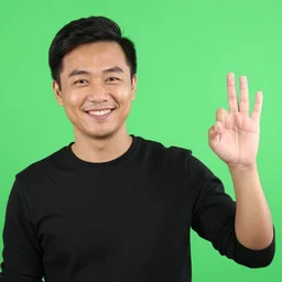 man smiling and giving a thomas up, green screen