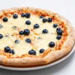 A delicious plate of pizza with blueberries on, extra cheese, close up food photography, studio lighting, Sigma 35mm f/1.4
